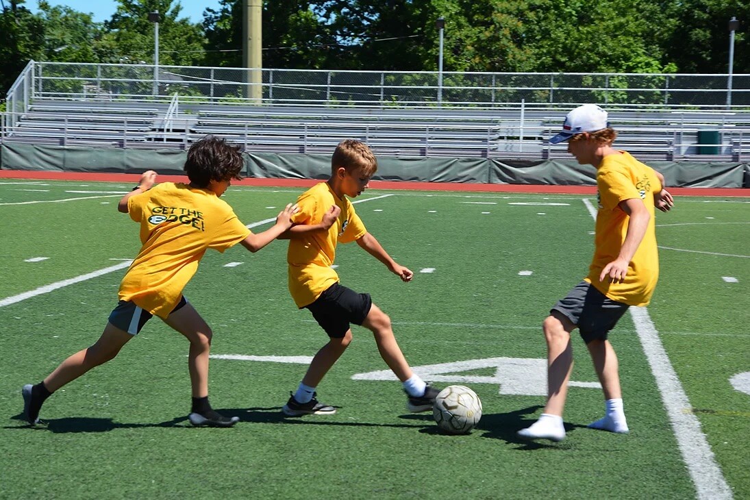 get the edge campers playing soccer